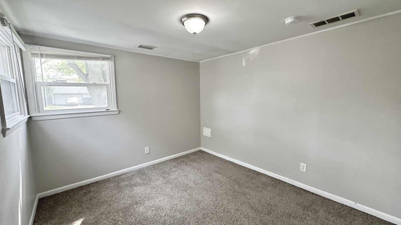 3512 John Street Steger, IL 60475 - Photo 8 of 18 an empty room with windows