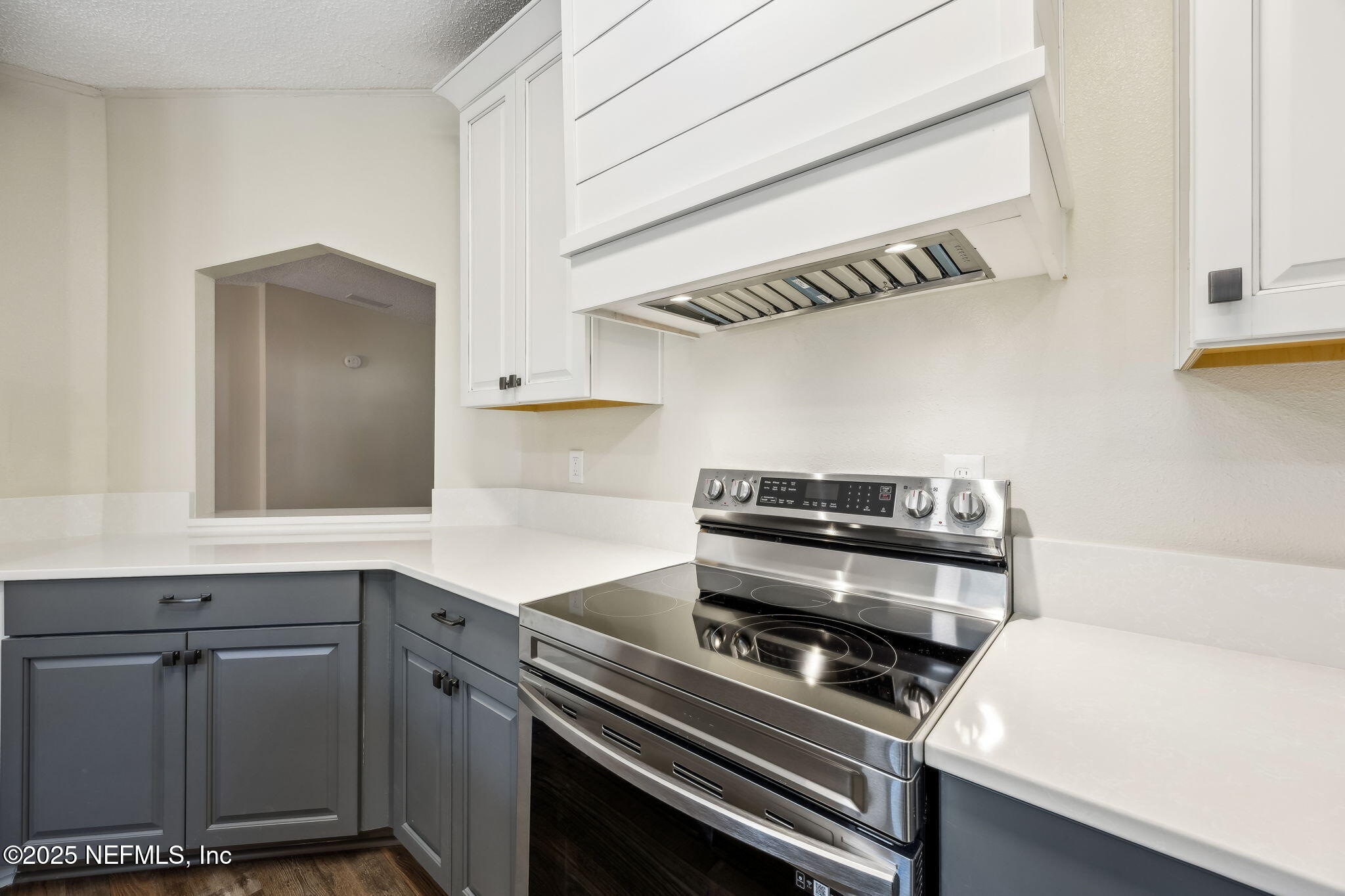 6034 Leona Padgett Road Jacksonville, FL 32234 - Photo 15 of 37 a kitchen with a stove and a white cabinets