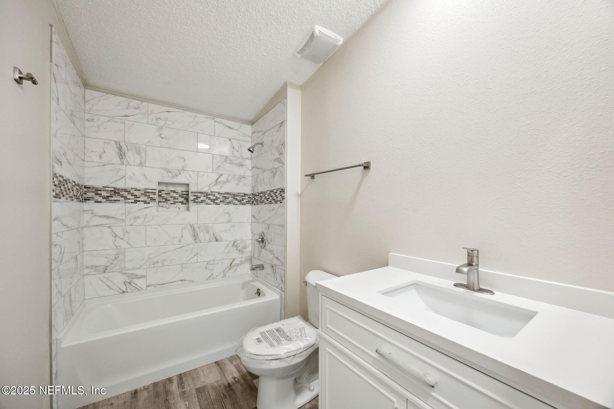 6034 Leona Padgett Road Jacksonville, FL 32234 - Photo 24 of 37 a bathroom with a sink toilet and shower