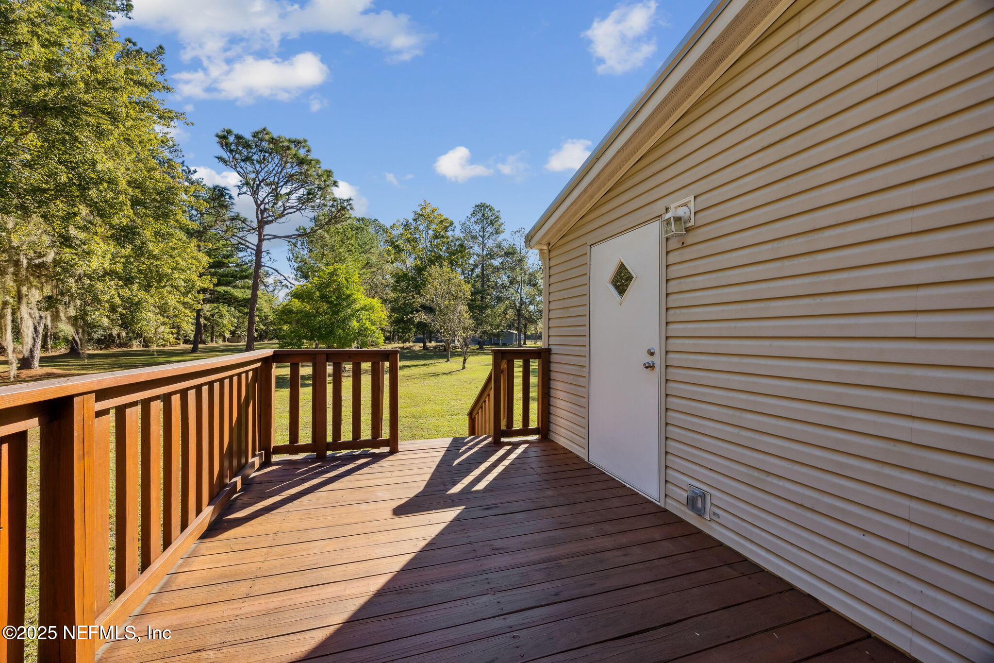 6034 Leona Padgett Road Jacksonville, FL 32234 - Photo 35 of 37 a view of balcony with wooden floor