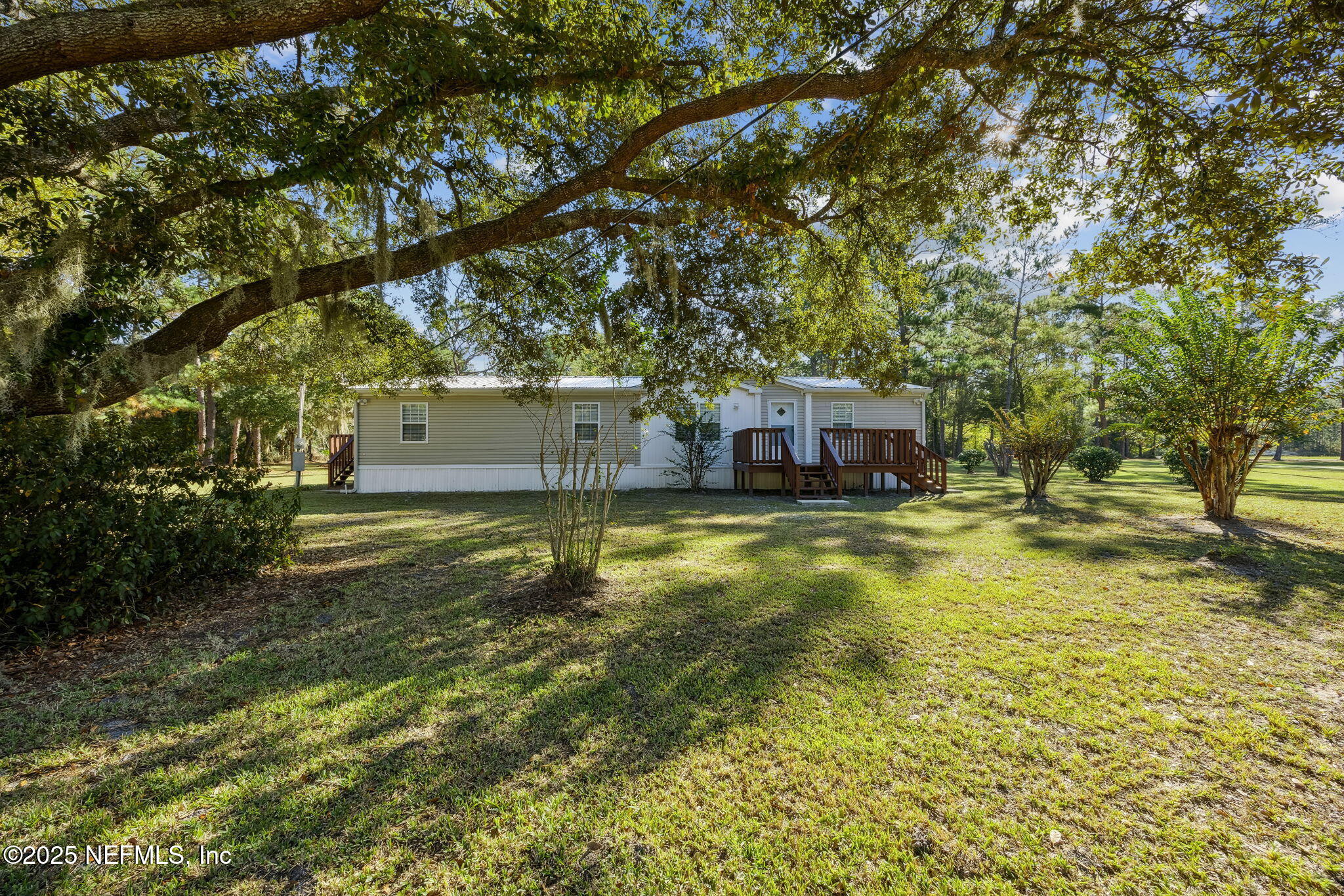 6034 Leona Padgett Road Jacksonville, FL 32234 - Photo 5 of 37 a view of a house with a yard