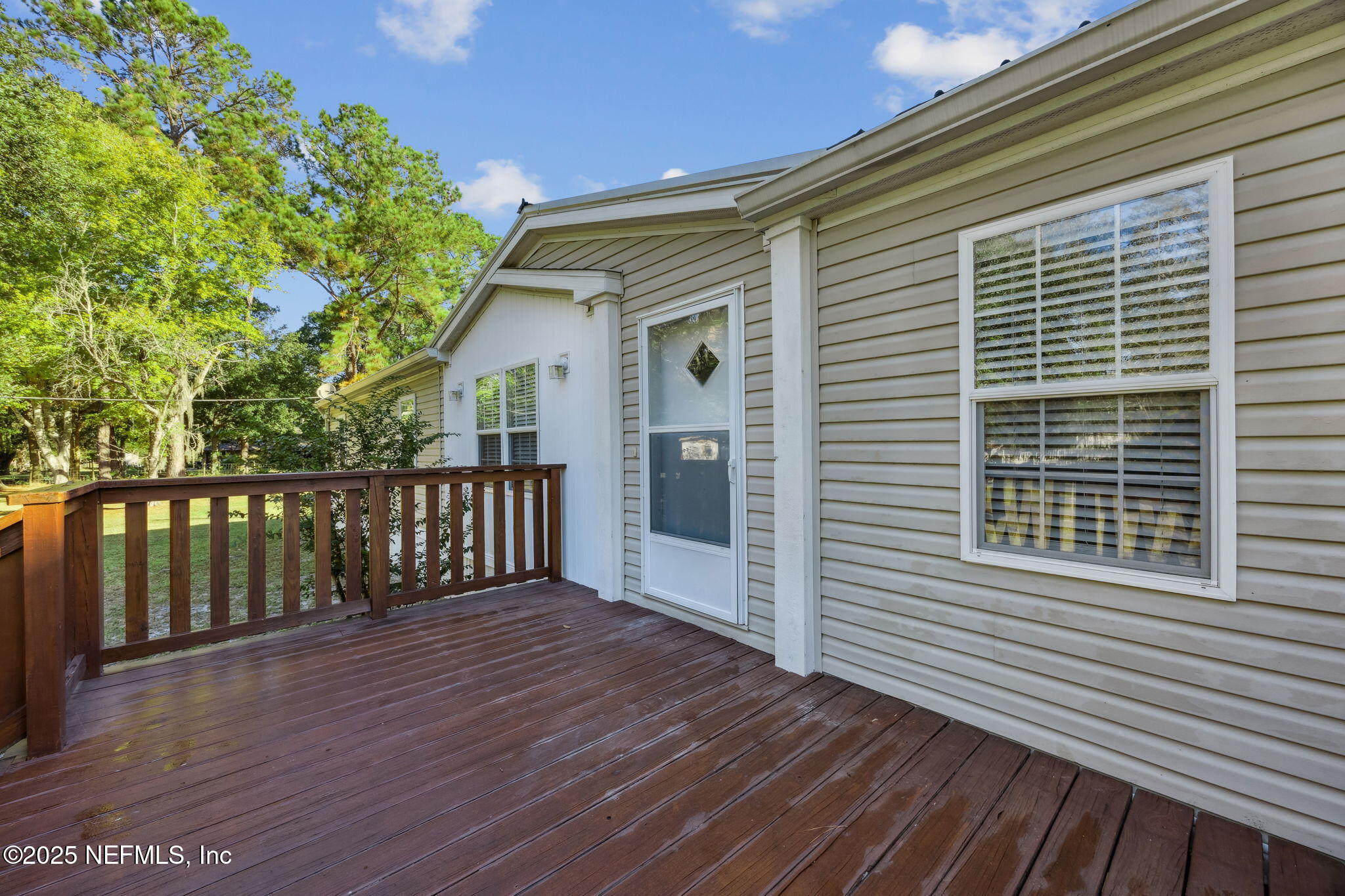 6034 Leona Padgett Road Jacksonville, FL 32234 - Photo 9 of 37 a view of a house with wooden deck
