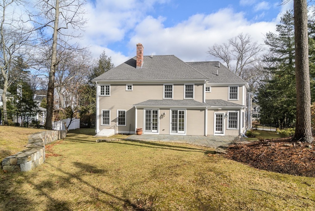 24 Audubon Road Wellesley, MA 02481 - Photo 16 of 19 a front view of a house with a yard