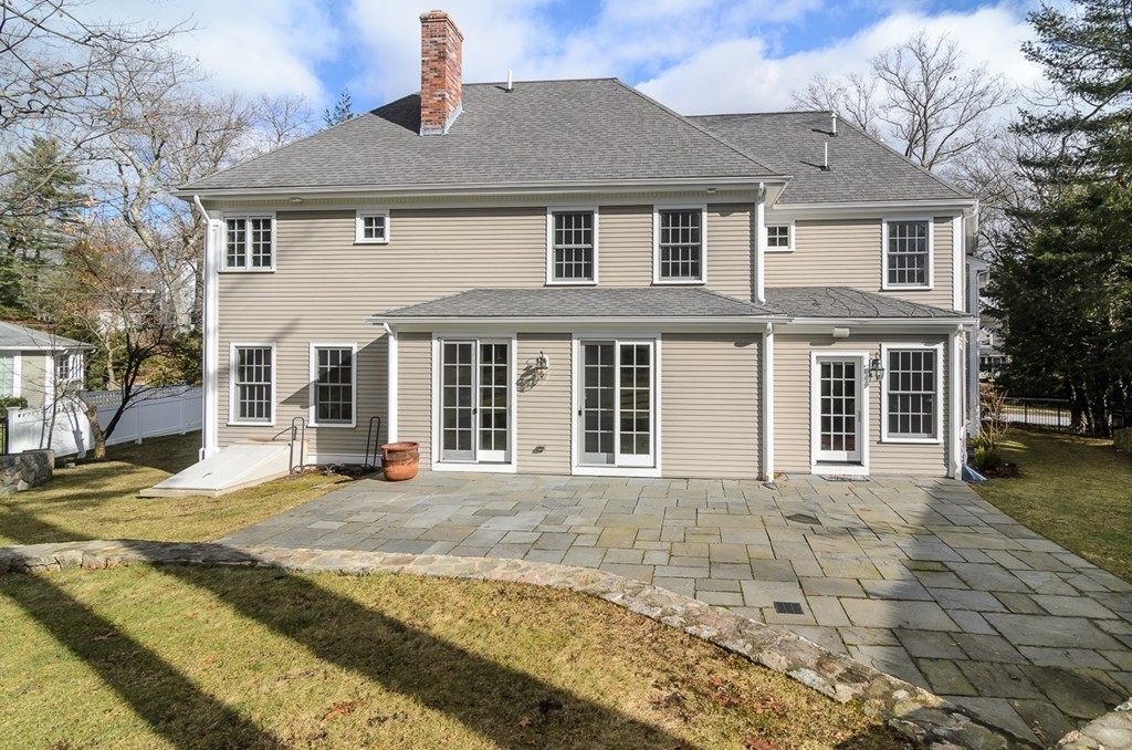 24 Audubon Road Wellesley, MA 02481 - Photo 18 of 19 a front view of a house with a yard