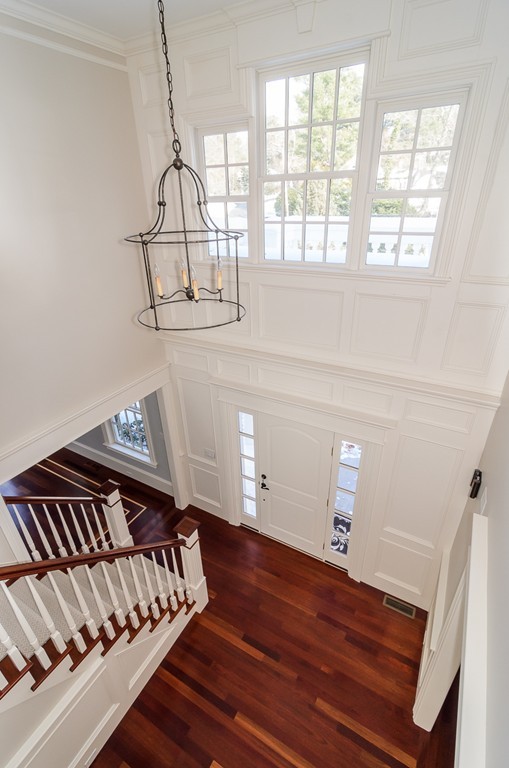 24 Audubon Road Wellesley, MA 02481 - Photo 3 of 19 a view of staircase with white walls and a window