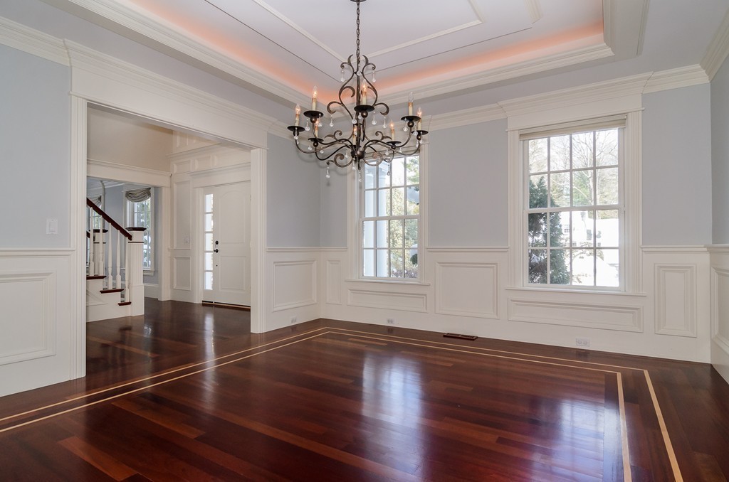 24 Audubon Road Wellesley, MA 02481 - Photo 4 of 19 a view of an empty room with wooden floor and a window