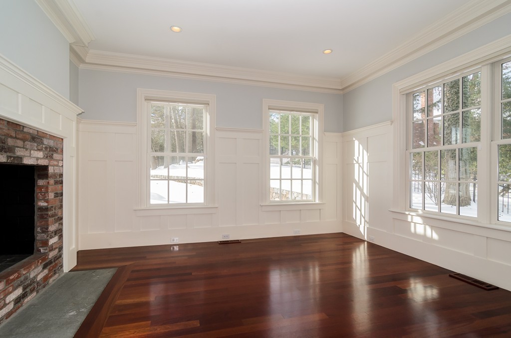 24 Audubon Road Wellesley, MA 02481 - Photo 6 of 19 a view of an empty room with wooden floor and a window