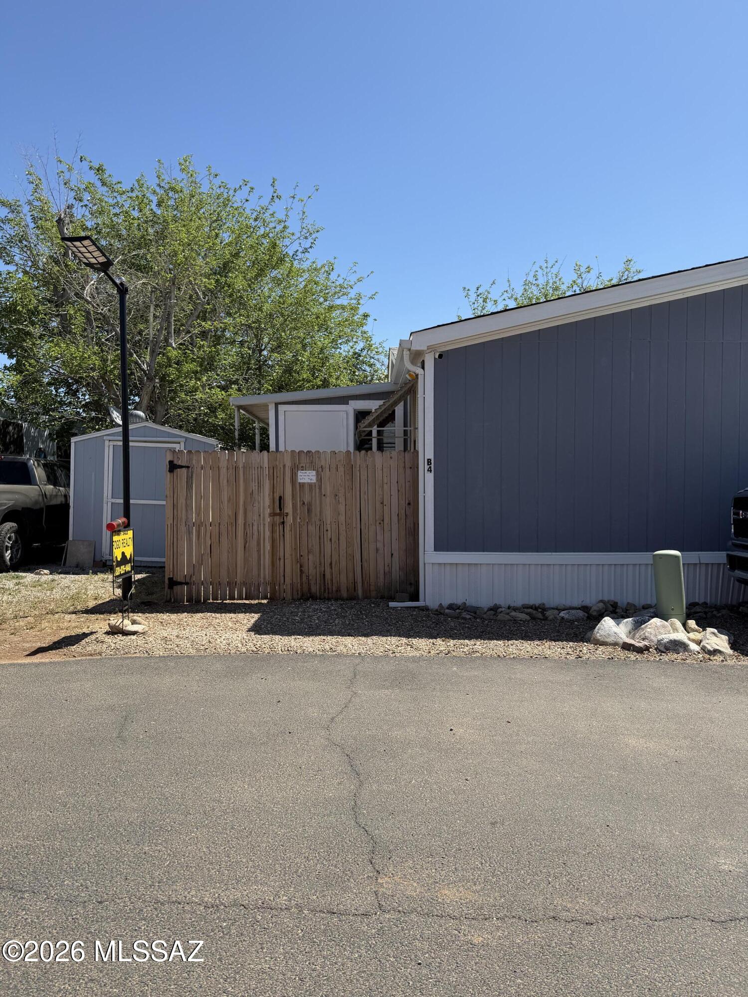 15770 North Oracle Road, Unit B4 Tucson, AZ 85739 - Photo 19 of 30 Front Door behind wood fence going into sun room