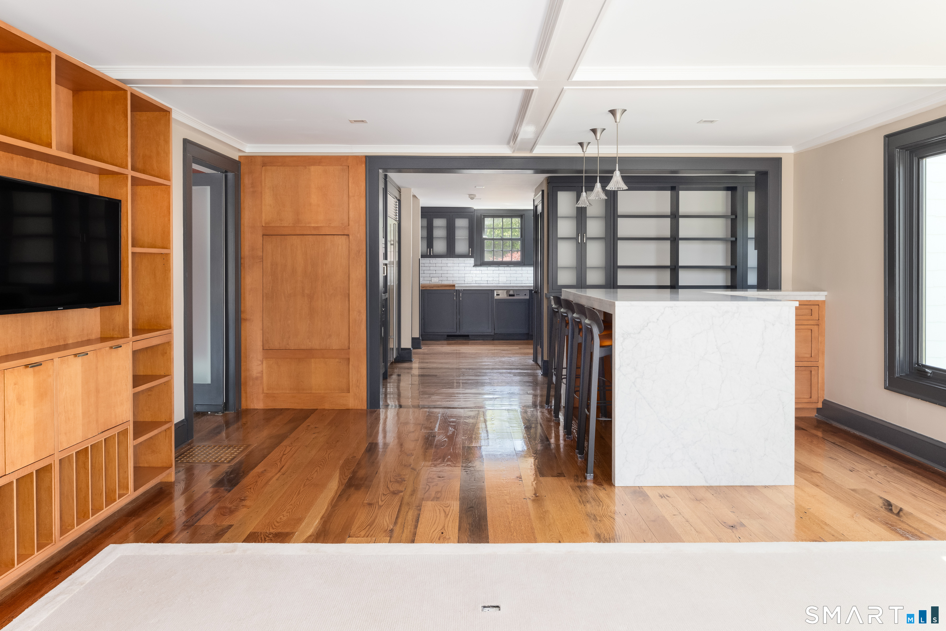 155 Long Ridge Road Danbury, CT 06810 - Photo 21 of 40 From the reverse angle, the scale of the room and its relationship to the kitchen become more fully