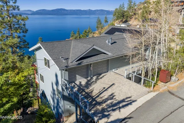 a view of house with outdoor space and sitting area