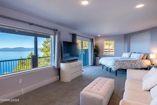 a bedroom with a bed and a couch