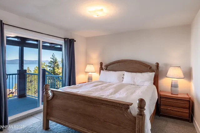 a bedroom with a bed and a night stand