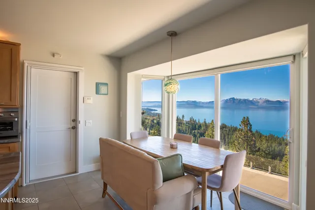 a view of a dining room with furniture window and outside view