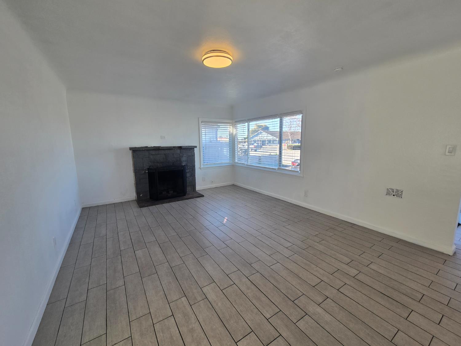 320 North Sanborn Road Salinas, CA 93905 - Photo 5 of 26 an empty room with windows and fireplace