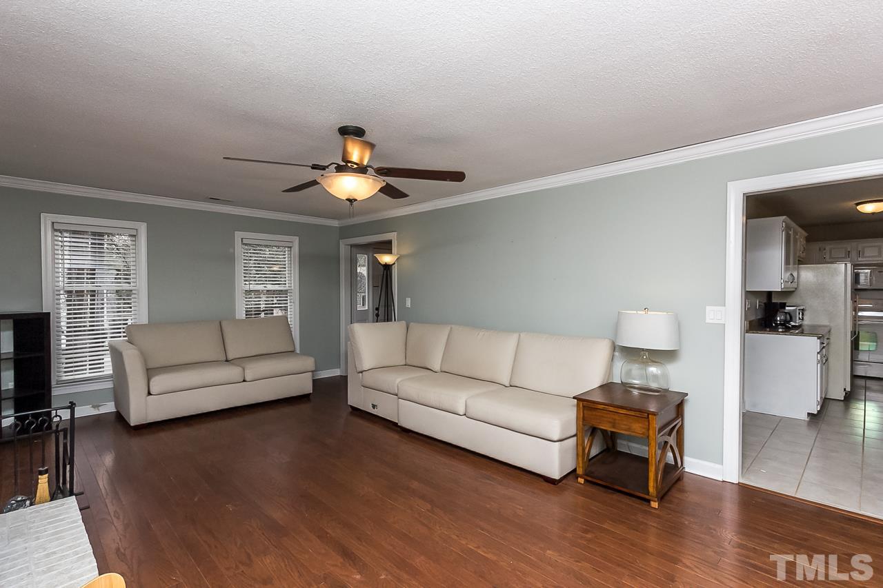 11916 Radner Way Raleigh, NC 27613 - Photo 2 of 29 a living room with furniture and a wooden floor