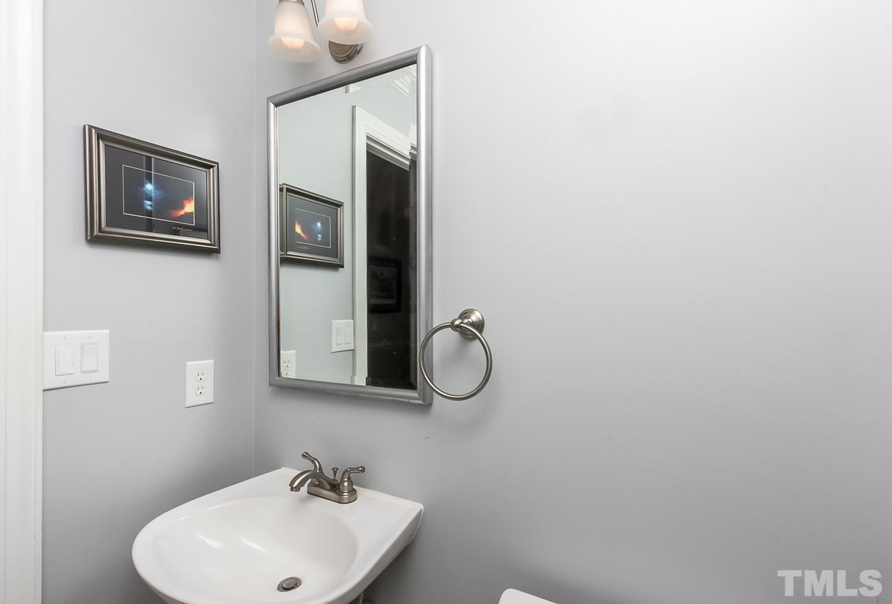 11916 Radner Way Raleigh, NC 27613 - Photo 13 of 29 a bathroom with a sink mirror and vanity