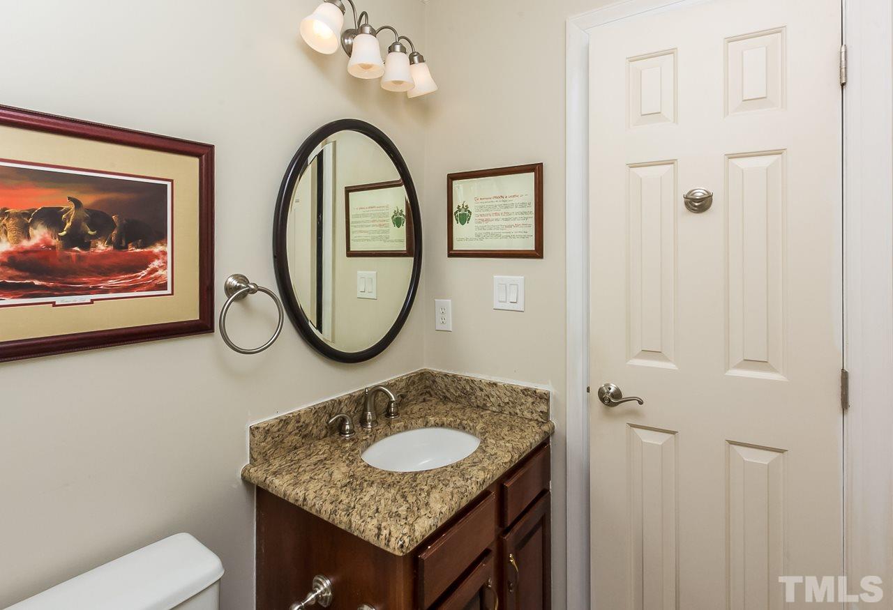 11916 Radner Way Raleigh, NC 27613 - Photo 16 of 29 a bathroom with a granite countertop sink and a mirror