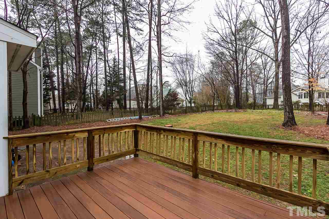 11916 Radner Way Raleigh, NC 27613 - Photo 26 of 29 a view of a balcony with wooden floor and trees