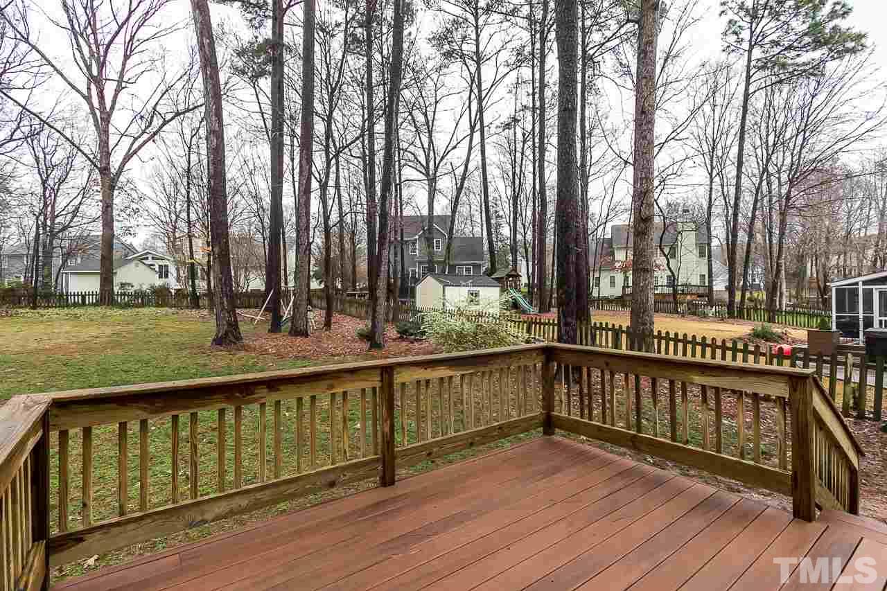 11916 Radner Way Raleigh, NC 27613 - Photo 27 of 29 a view of a deck with large trees and wooden fence