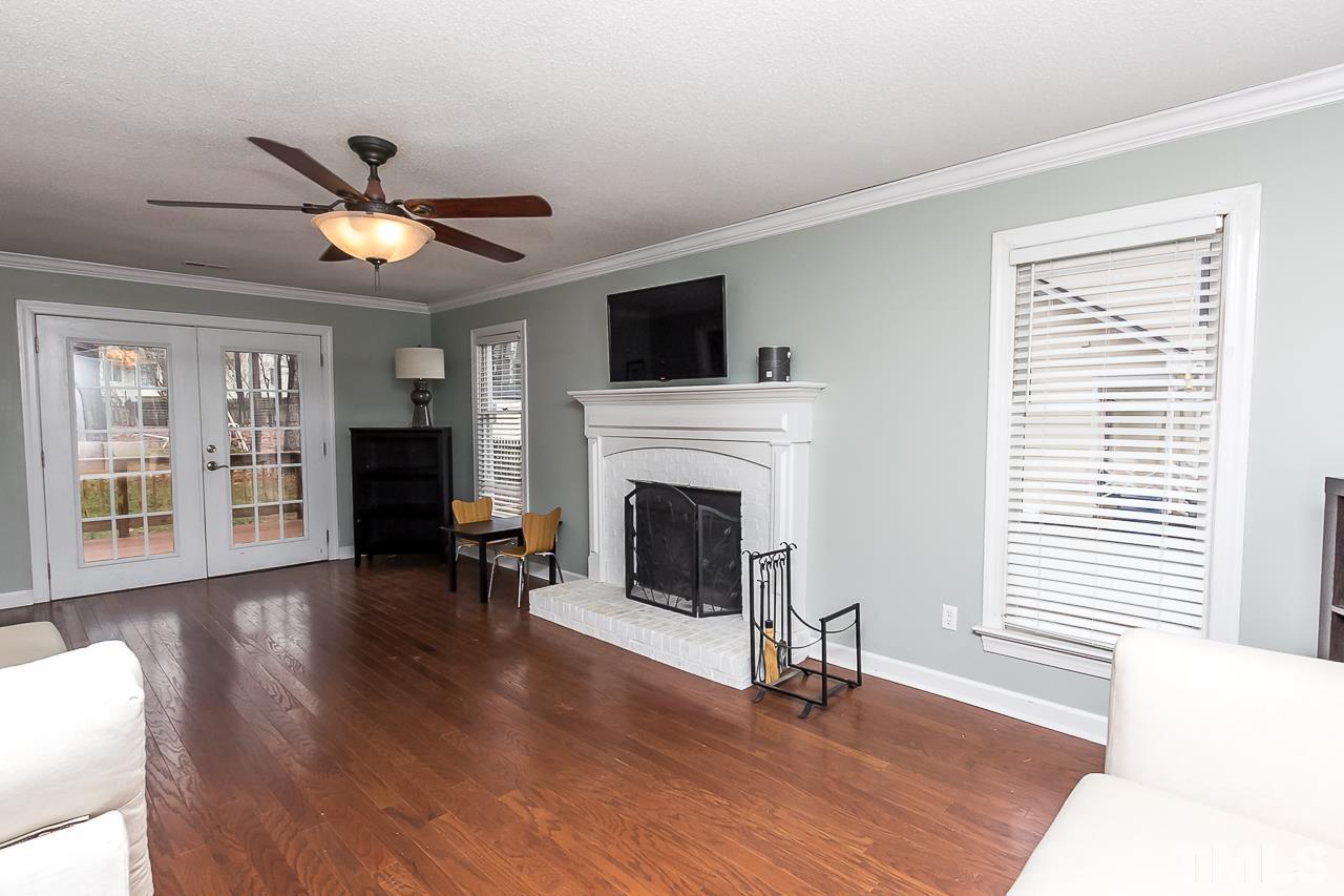 11916 Radner Way Raleigh, NC 27613 - Photo 4 of 29 a living room with furniture and a fireplace