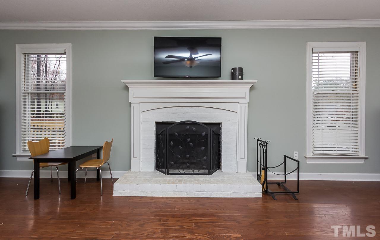 11916 Radner Way Raleigh, NC 27613 - Photo 5 of 29 a living room with furniture and a fireplace
