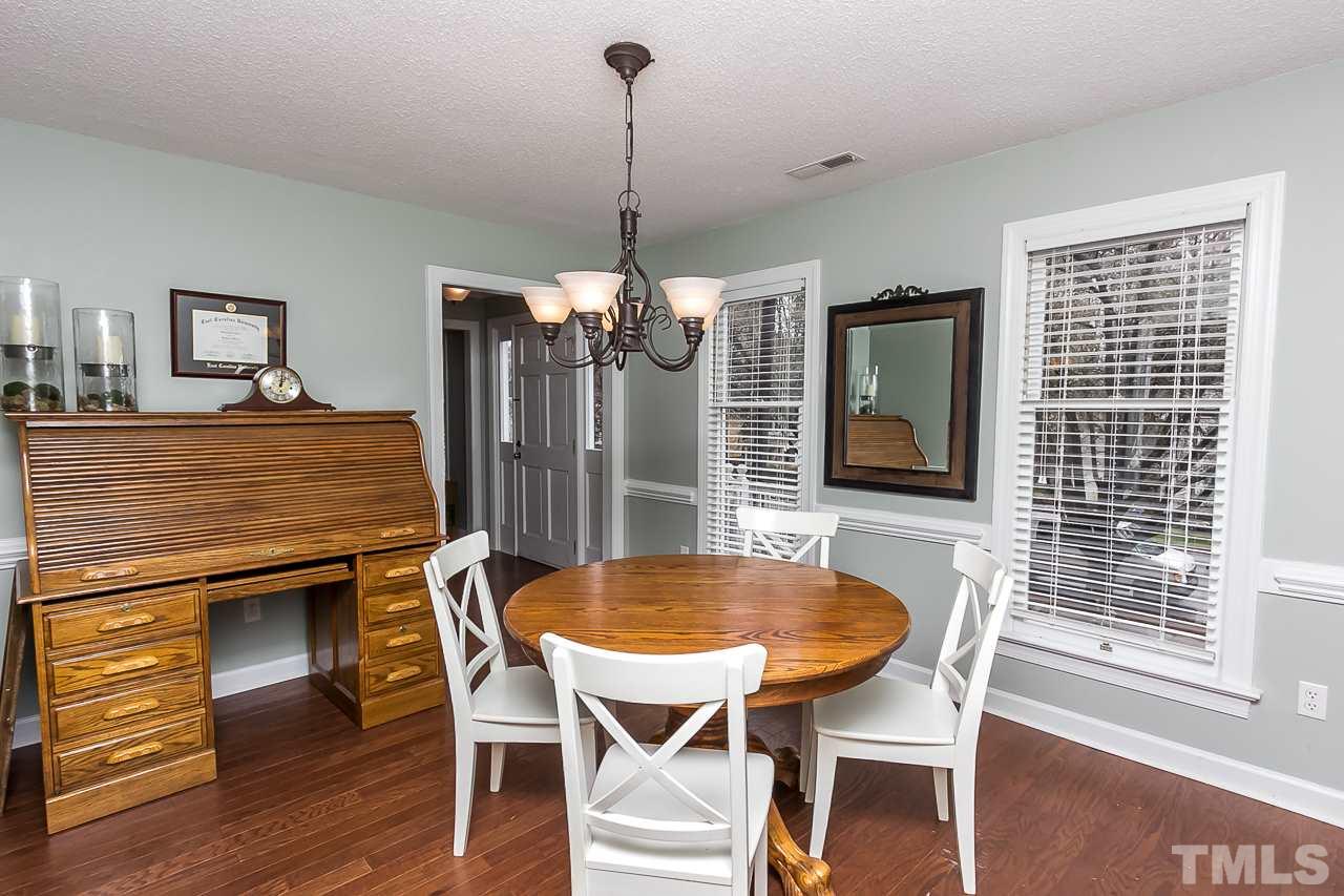 11916 Radner Way Raleigh, NC 27613 - Photo 10 of 29 a view of a dining room with furniture window and wooden floor
