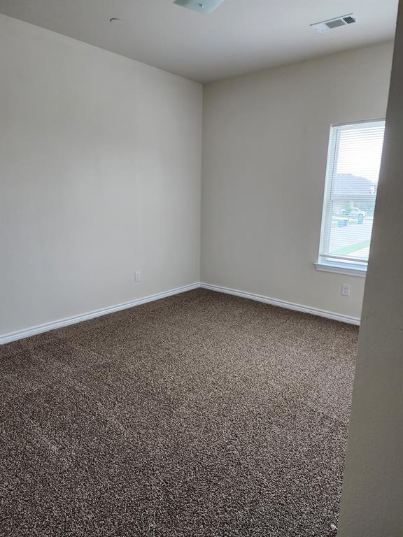 5516 Del Rey Drive Denton, TX 76208 - Photo 14 of 16 an empty room with a window