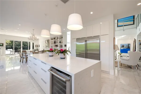 a kitchen with stainless steel appliances white cabinets and a stove