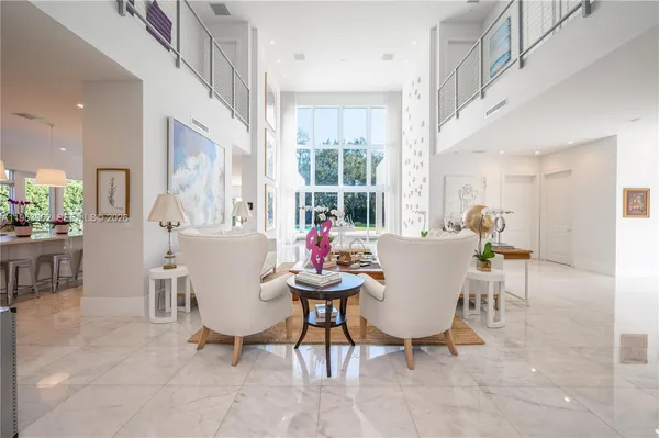 a view of a dining room with furniture and a window