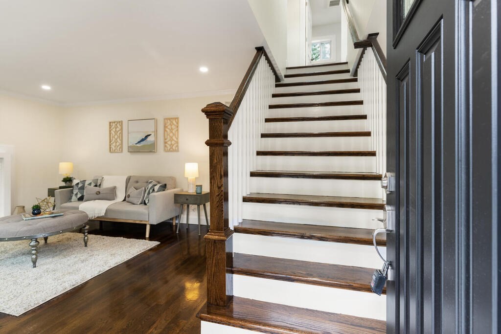 39 Desoto Road Boston, MA 02132 - Photo 8 of 30 a living room with furniture and stairs