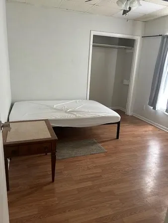 a room with a table and wooden floor