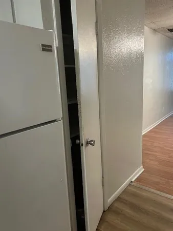 a bathroom with a glass shower door