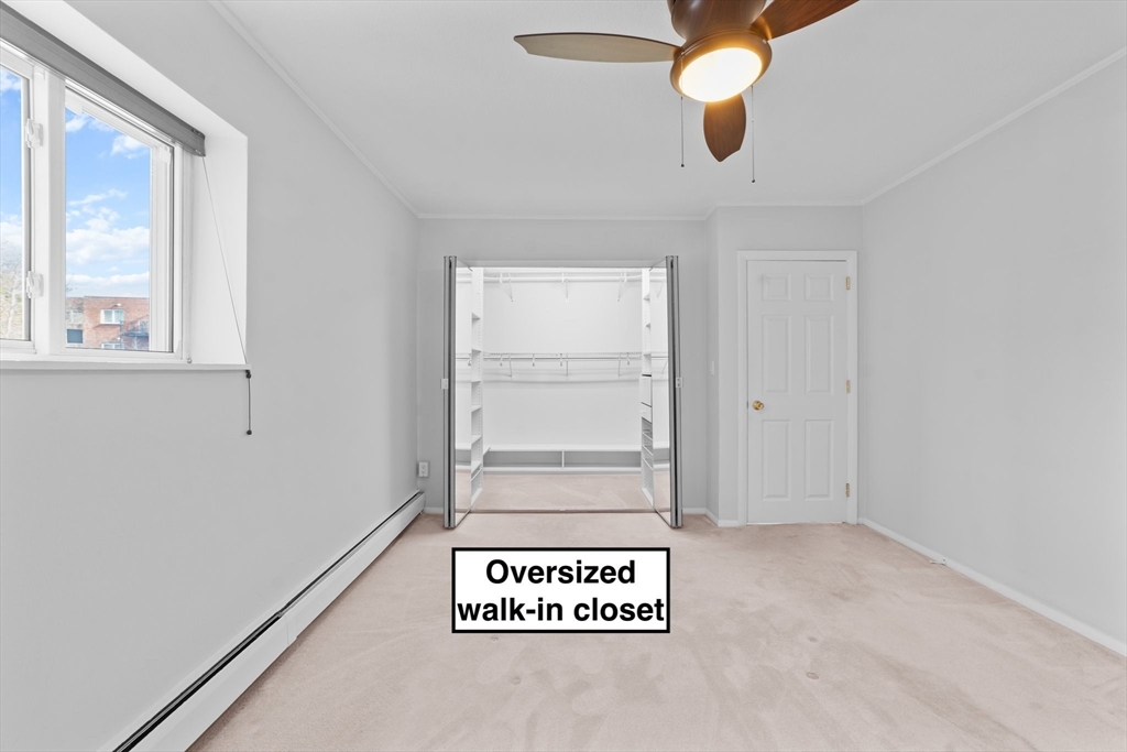 26 Westgate Road, Unit 264 Chestnut Hill, MA 02467 - Photo 11 of 30 an empty room with window