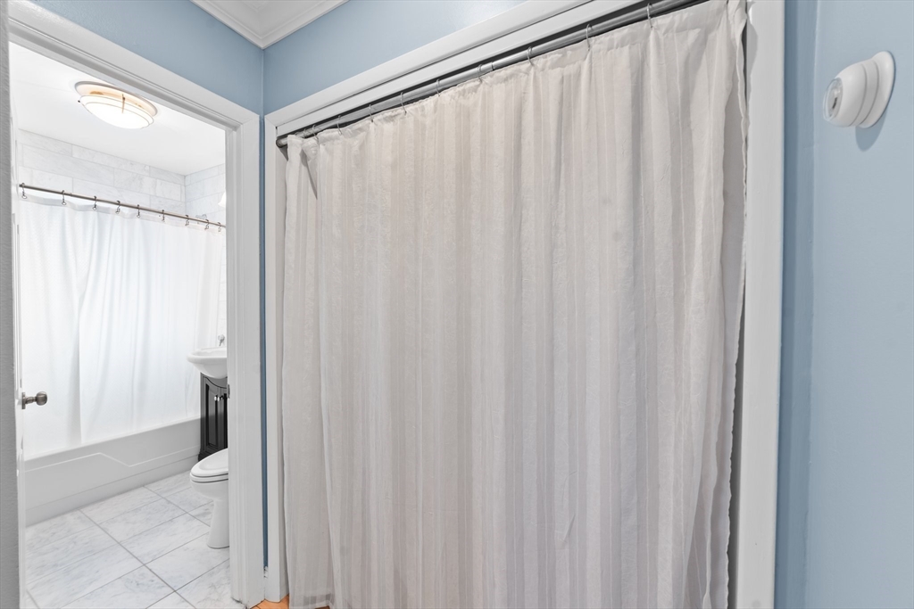 26 Westgate Road, Unit 264 Chestnut Hill, MA 02467 - Photo 13 of 30 a view of a bathroom with shower curtain