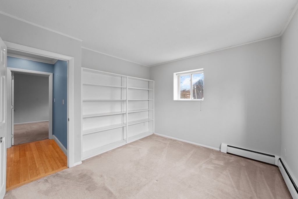 26 Westgate Road, Unit 264 Chestnut Hill, MA 02467 - Photo 19 of 30 an empty room with a empty space and window