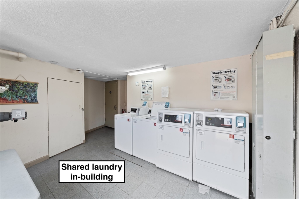 26 Westgate Road, Unit 264 Chestnut Hill, MA 02467 - Photo 25 of 30 a view of a hallway with washer and dryer