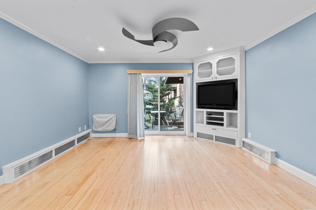 26 Westgate Road, Unit 264 Chestnut Hill, MA 02467 - Photo 5 of 30 a view of a livingroom with wooden floor and furniture