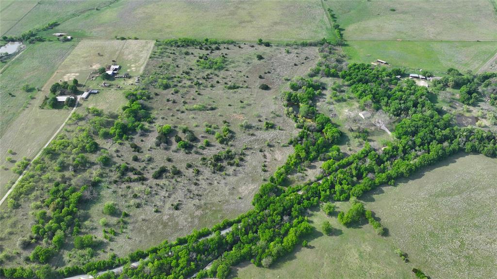 2 Hcr 1136 Rio Vista Rio Vista, TX 76093 - Photo 2 of 5 an aerial view of a house with a yard