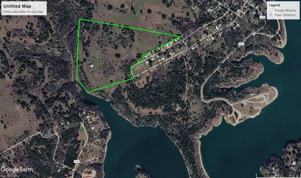 an aerial view of a house with a lake view