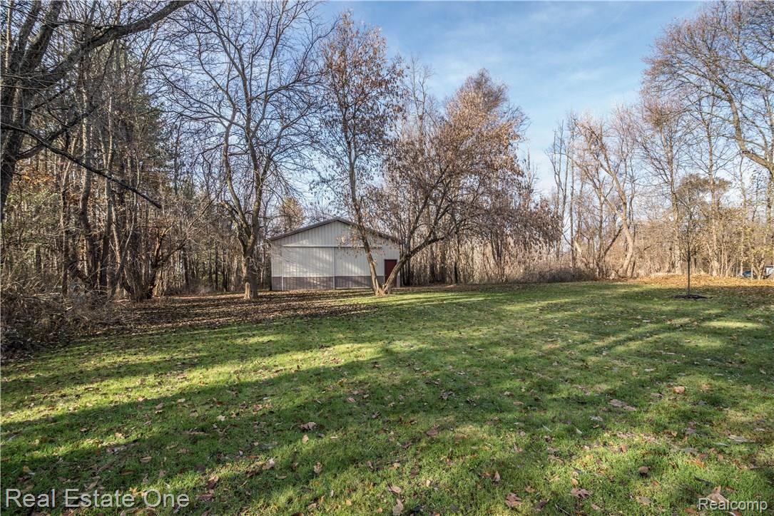8519 Tindall Road Davisburg, MI 48350 - Photo 7 of 41 Shaded with mature trees, this yard offers lots of privacy and seclusion.