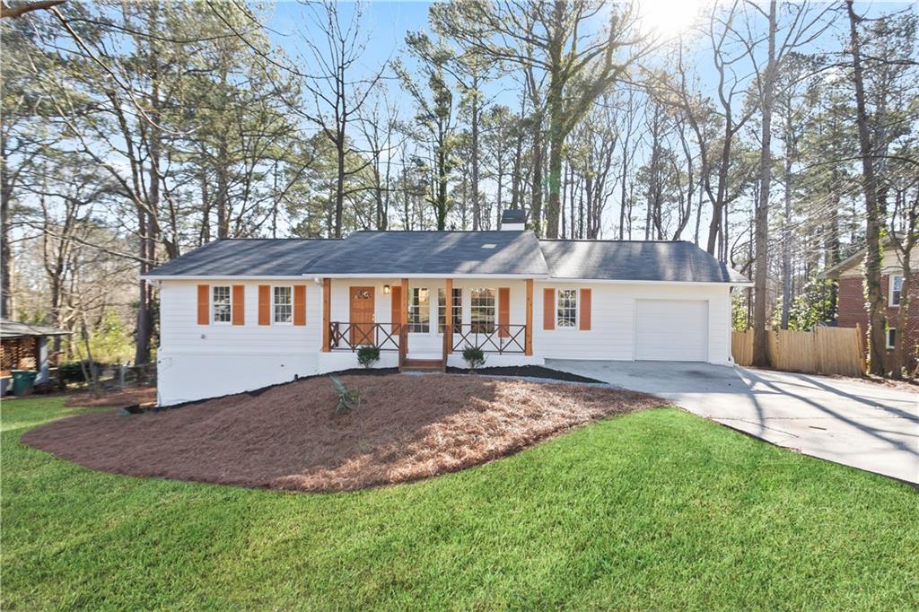 626 Reed Road Smyrna, GA 30082 - Photo 1 of 40 front view of a house with a yard