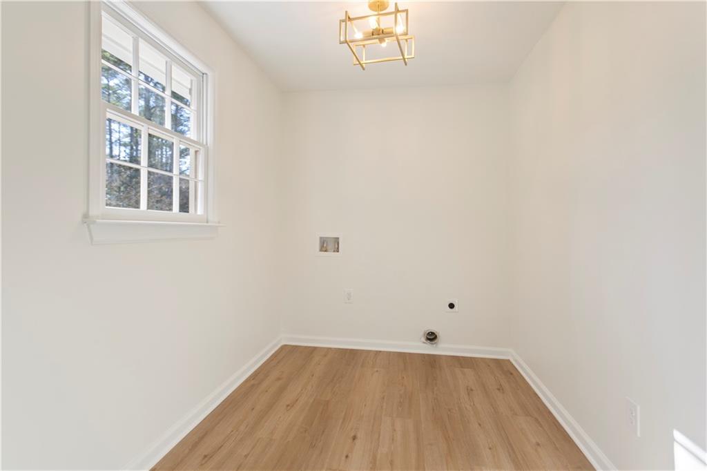 626 Reed Road Smyrna, GA 30082 - Photo 17 of 40 a view of a room with wooden floor and windows
