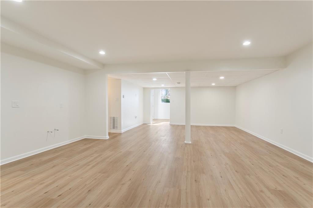 626 Reed Road Smyrna, GA 30082 - Photo 32 of 40 a view of an empty room with wooden floor