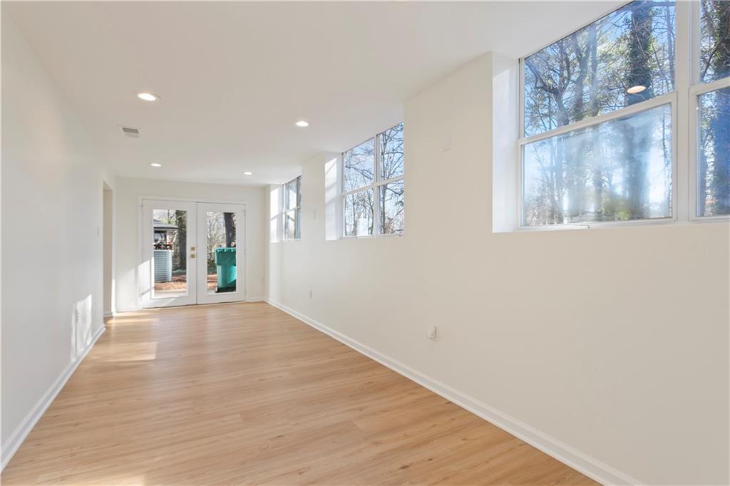 626 Reed Road Smyrna, GA 30082 - Photo 35 of 40 a view of an empty room with wooden floor and a window