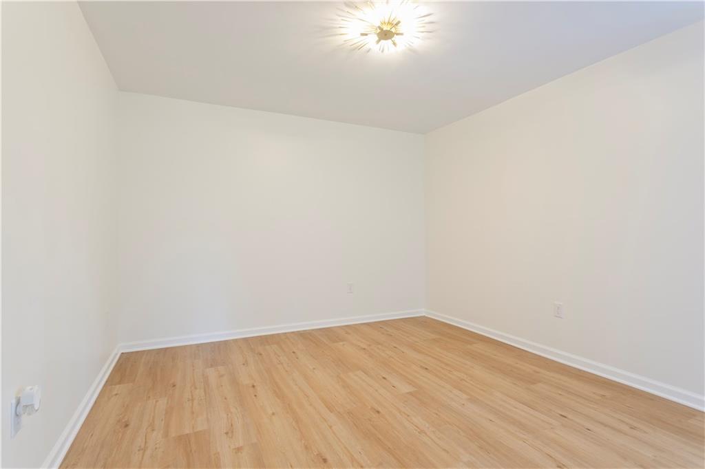 626 Reed Road Smyrna, GA 30082 - Photo 38 of 40 a view of a room with wooden floor and a ceiling fan