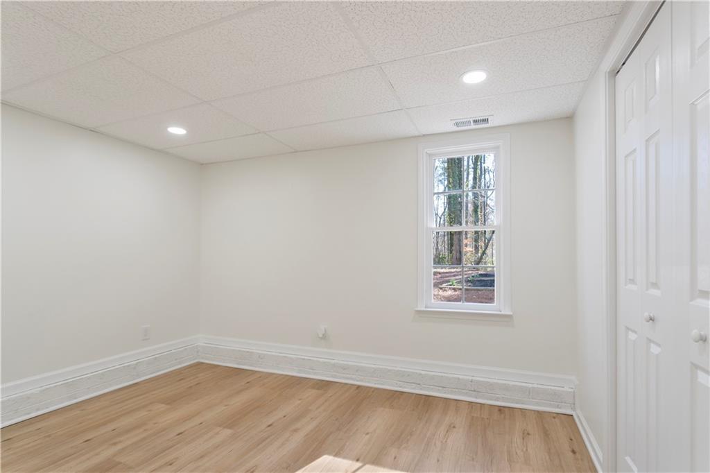 626 Reed Road Smyrna, GA 30082 - Photo 39 of 40 wooden floor in an empty room with a window
