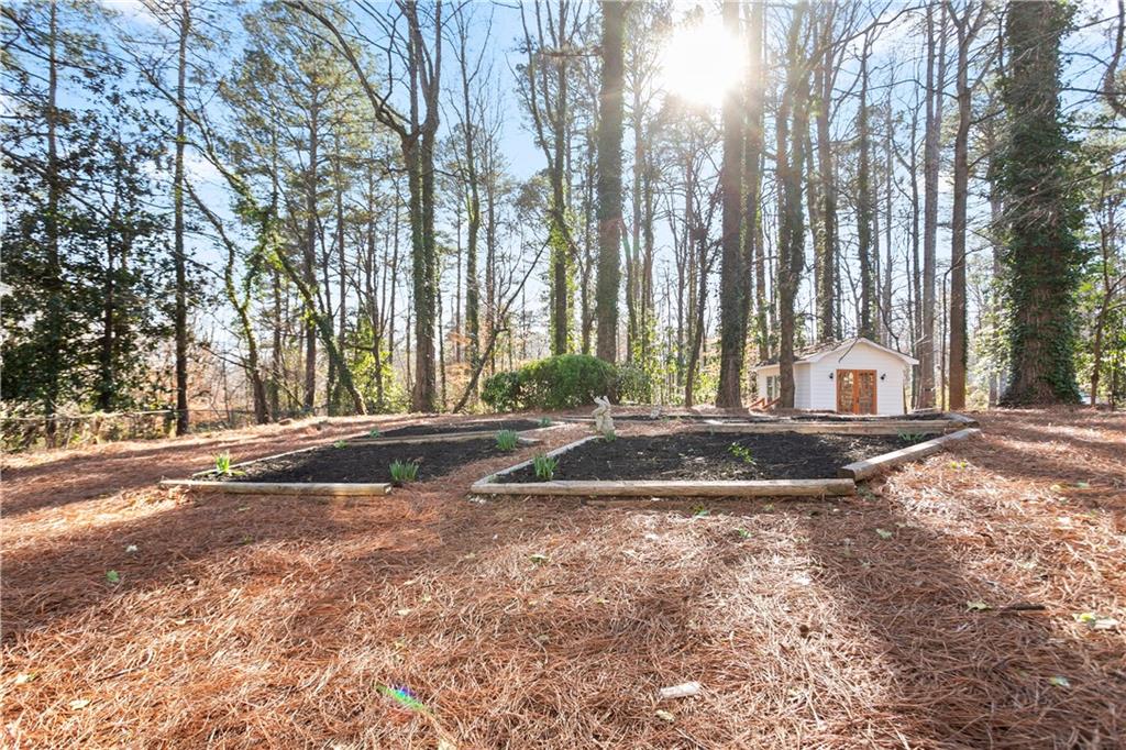 626 Reed Road Smyrna, GA 30082 - Photo 7 of 40 a view of a house with a yard covered with snow