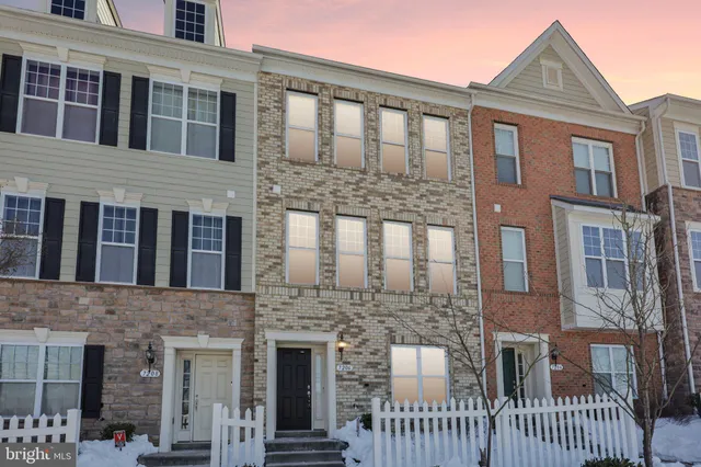 a front view of a house with glass windows