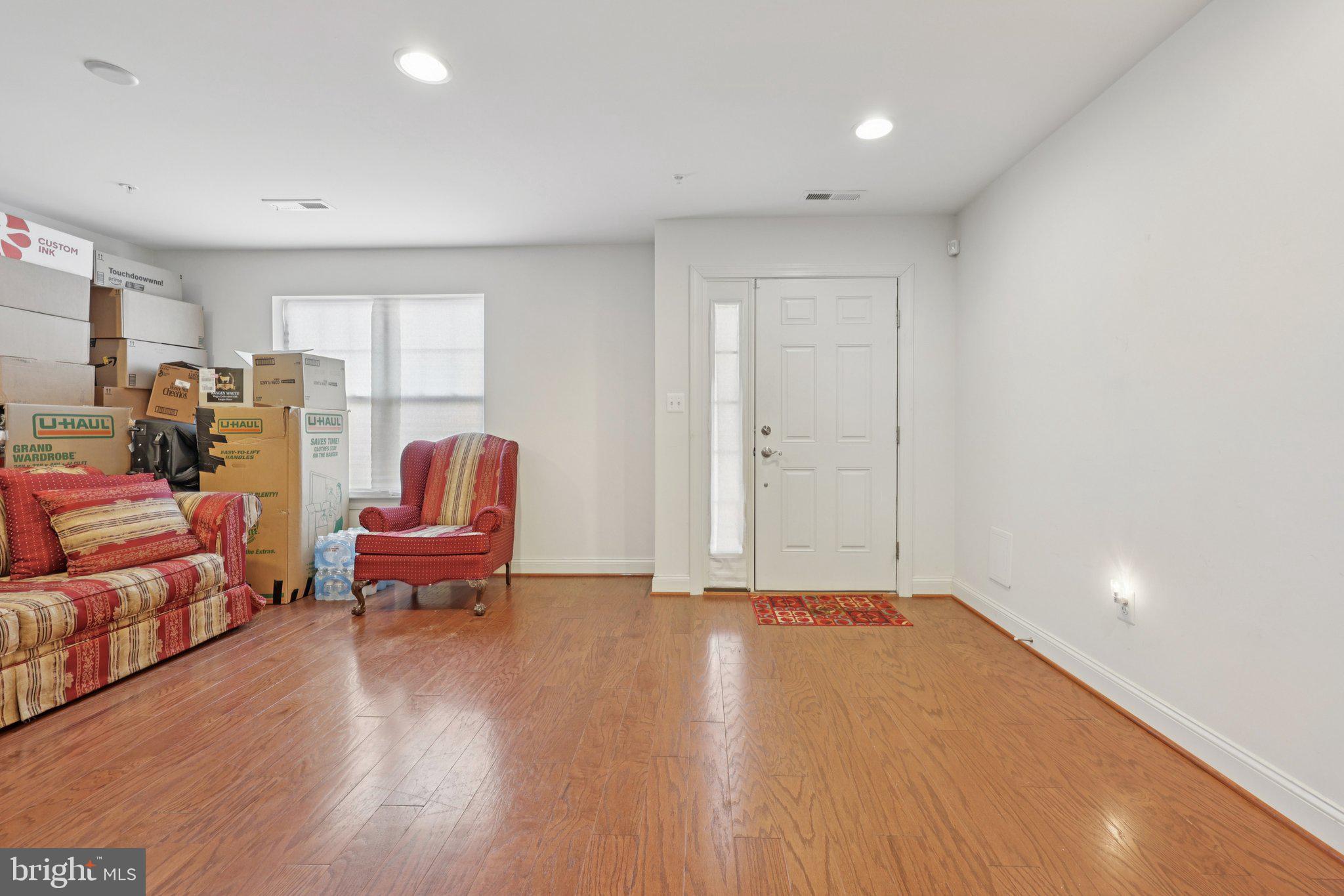 7206 Wood Meadow Way Lanham, MD 20706 - Photo 13 of 61 a living room with furniture and a wooden floor