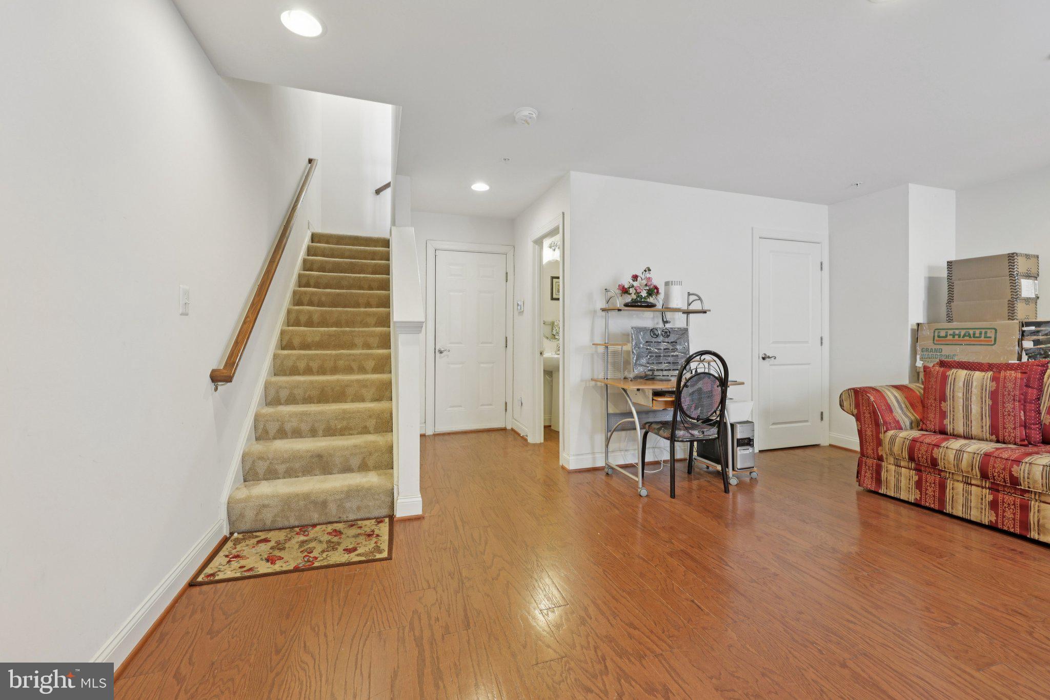 7206 Wood Meadow Way Lanham, MD 20706 - Photo 15 of 61 a view of a livingroom with furniture and a chair